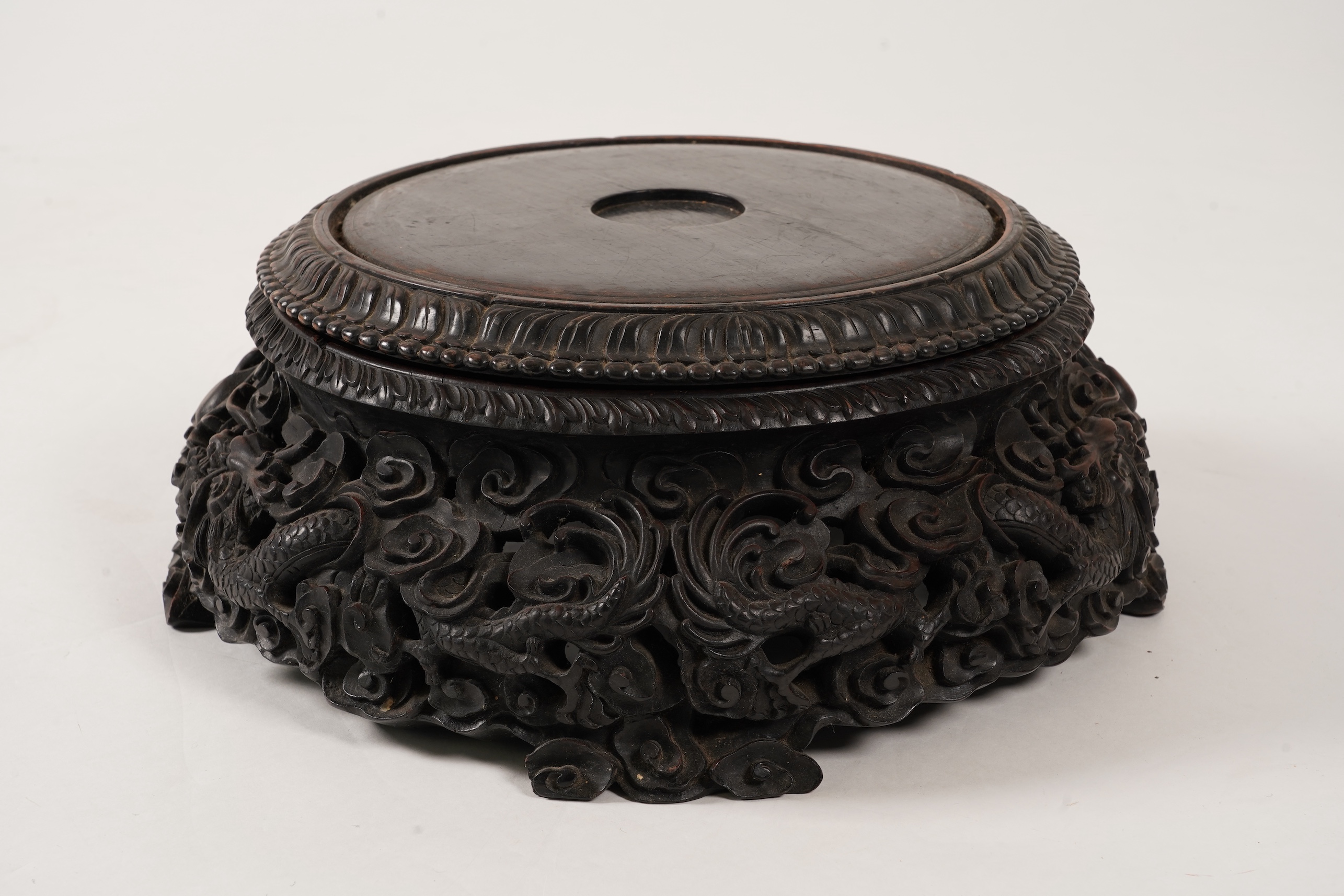 An impressive Chinese hongmu ‘dragon’ stand, late 19th century